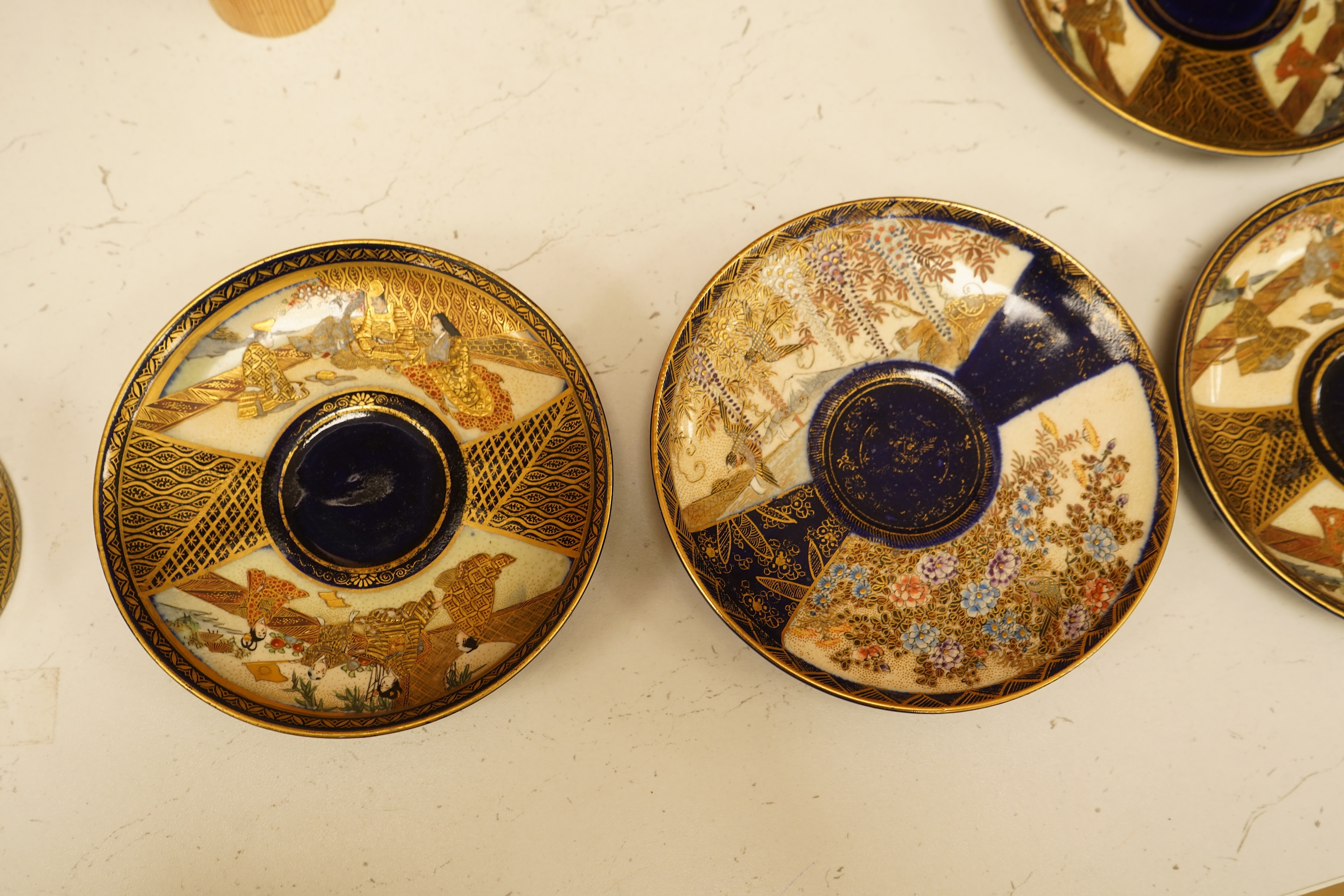 A set of six Japanese Satsuma pottery teacups and saucers, and two further saucers